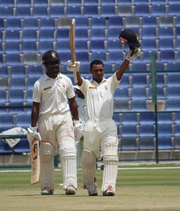Lega Siaka celebrates scoring his maiden first class century against the UAE.