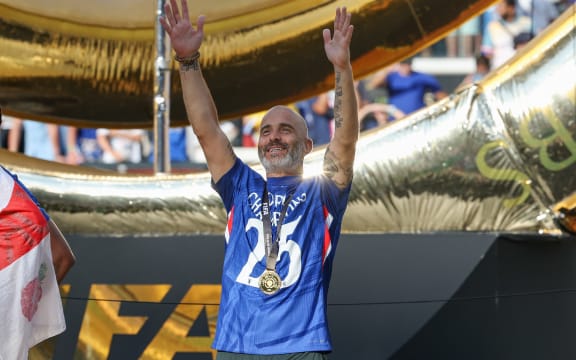 Chelsea head coach Enzo Maresca waives to the crowd after the FIFA Club World Cup Final between Chelsea and Paris Saint-Germain, 2025.