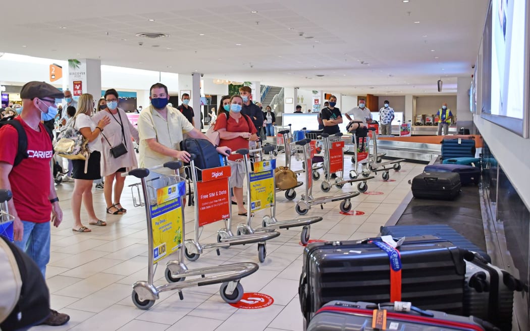 Travellers at Fiji's Nadi Airport.