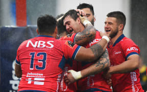 Tasman players celebrate Liam Squire.