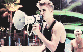 A gif of Justin Bieber with a megaphone