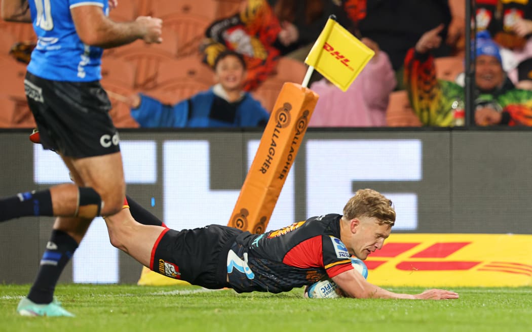 Chiefs first five Damian McKenzie scores a try against the Western Force at FMG Stadium.