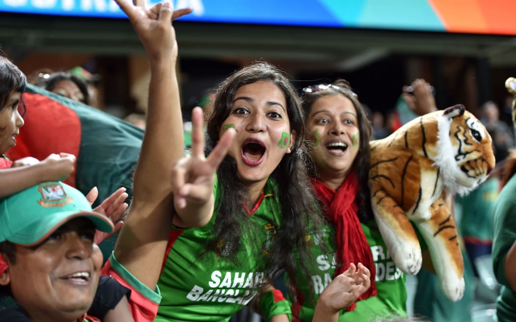 Bangladesh fans at the Adelaide Oval celebrate victory.