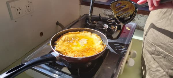 A whitebait fritter on the stove.