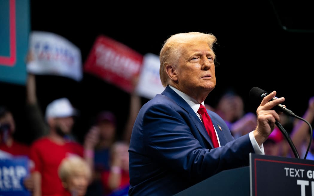 SAVANNAH, GEORGIA - SEPTEMBER 24: Republican Presidential candidate, former U.S. President Donald Trump speaks to attendees during a campaign rally at the Johnny Mercer Theatre on September 24, 2024 in Savannah, Georgia. The former president spoke to attendees on various plans including the tax code, U.S. manufacturing, and future economic opportunities if reelected for a second term. Trump continues campaigning around the country ahead of the November 6 presidential election.   Brandon Bell/Getty Images/AFP (Photo by Brandon Bell / GETTY IMAGES NORTH AMERICA / Getty Images via AFP)