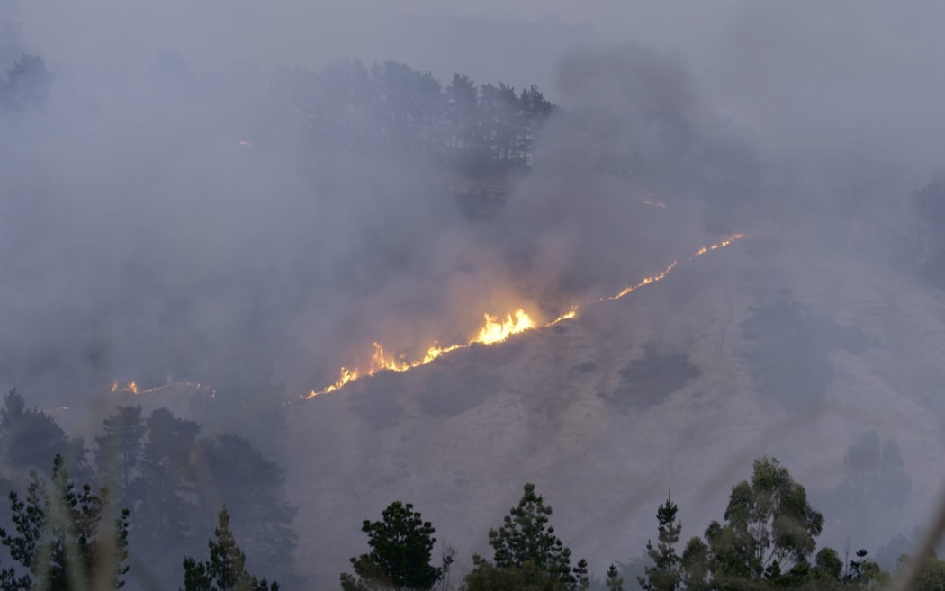 A line of flames on the hill.