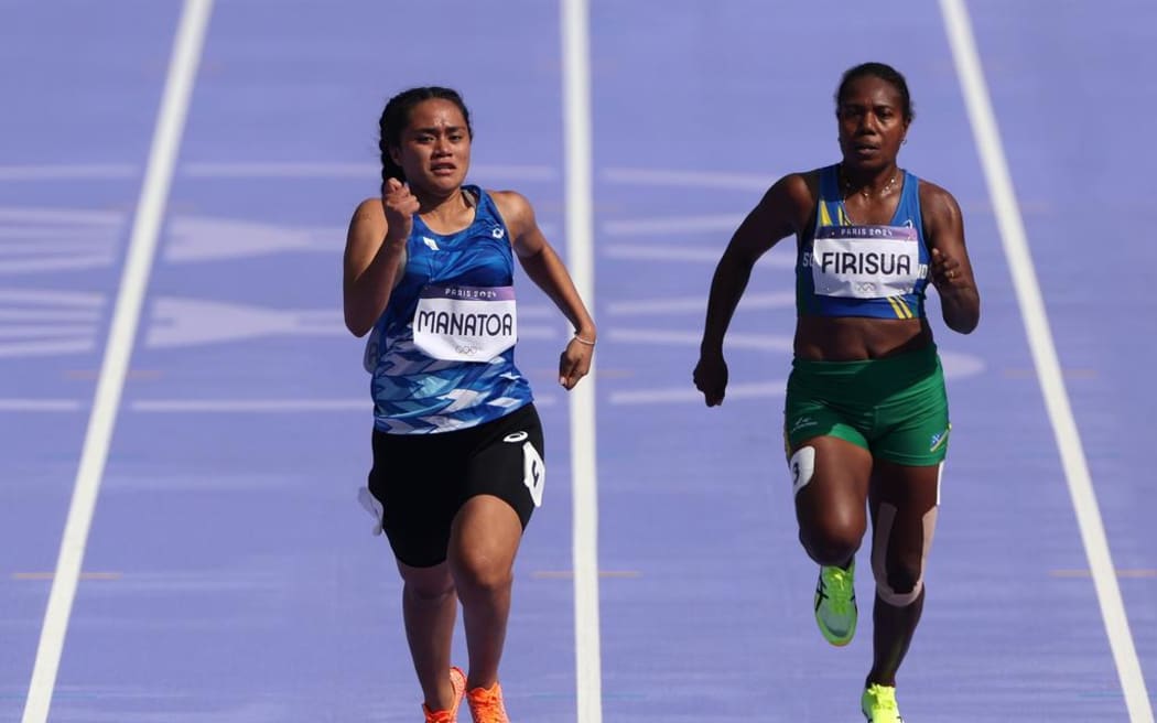 Firisua, right, clocked a time of 14.31 seconds in the women's preliminary round at the Stade de France.