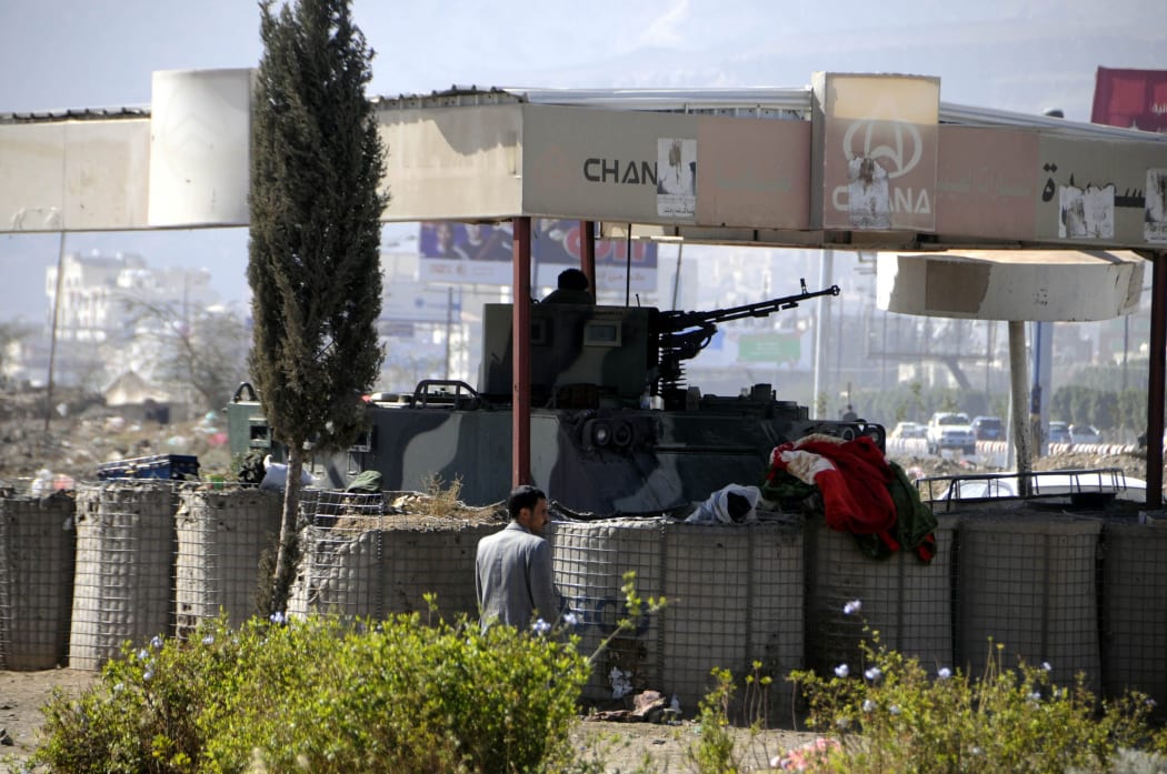 An armoured tank is seen at Sebin Square in Sana'a on 22 January.