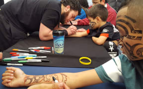 Rangatahi were getting inked up with temporary moko for their performances.