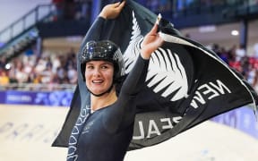 Picture by Zac Williams/SWpix.com - 11/08/2024 -  Paris 2024 Olympic Games - Track Cycling - National Velodrome, Saint-Quentin-en-Yvelines, France - Women’s Sprint Final for Gold - Ellesse Andrews (New Zealand) celebrates winning the Women's Sprint to become Olympic Champion