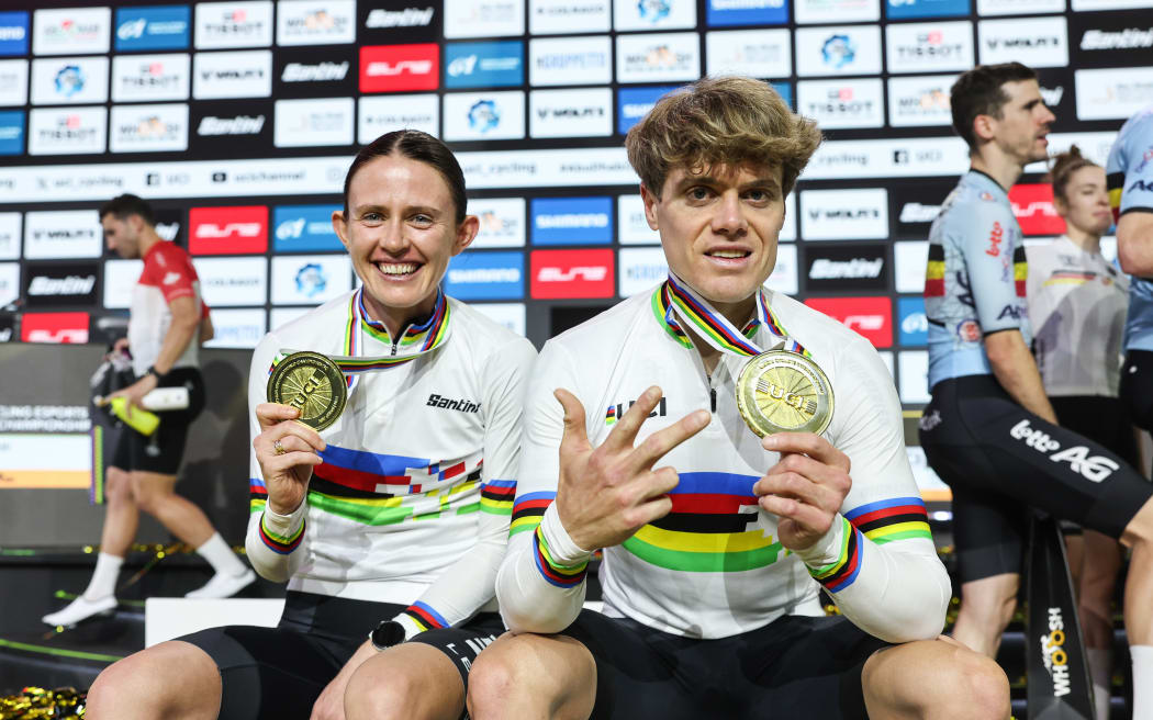 Picture by Alex Whitehead/SWpix.com - 15/11/2025 - Cycling - 2025 UCI Cycling Esports World Championships powered by MyWhoosh - Space42 Arena, Abu Dhabi, UAE - Kate McCarthy (New Zealand) and Jason Osborne (Germany) Esports World Champions