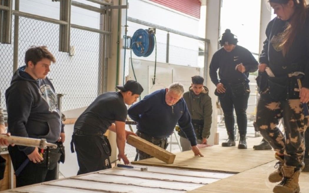 A tutor teaching trades students at UCOL polytechnic, in the lower North Island.