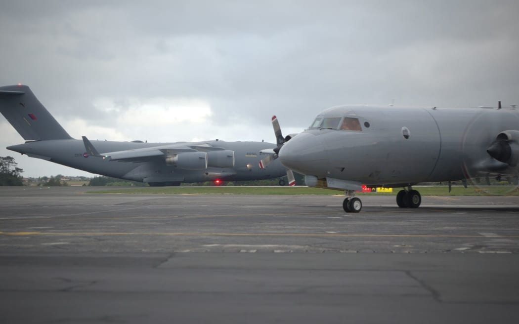 The RAF C-17 Globemaster from the UK and the RNZAC P-3K2 Orion land at Whenuapai Air Base in Auckland.