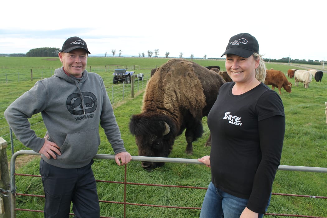 Blair and Nadia Wisely with Bobo the bison.