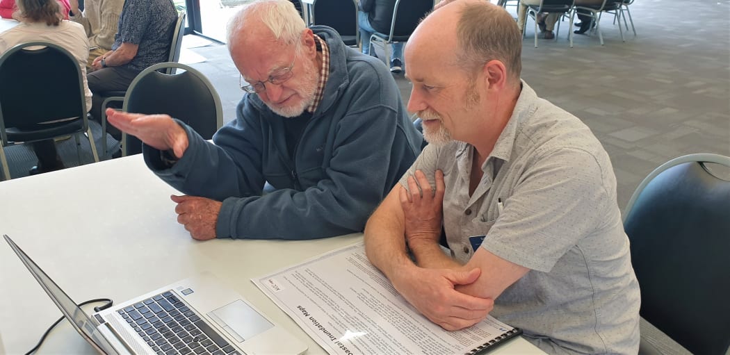 Paul Bieleski of Nelson (left) and council flood engineer Toby Kay discuss proposed sea level rise in Nelson.