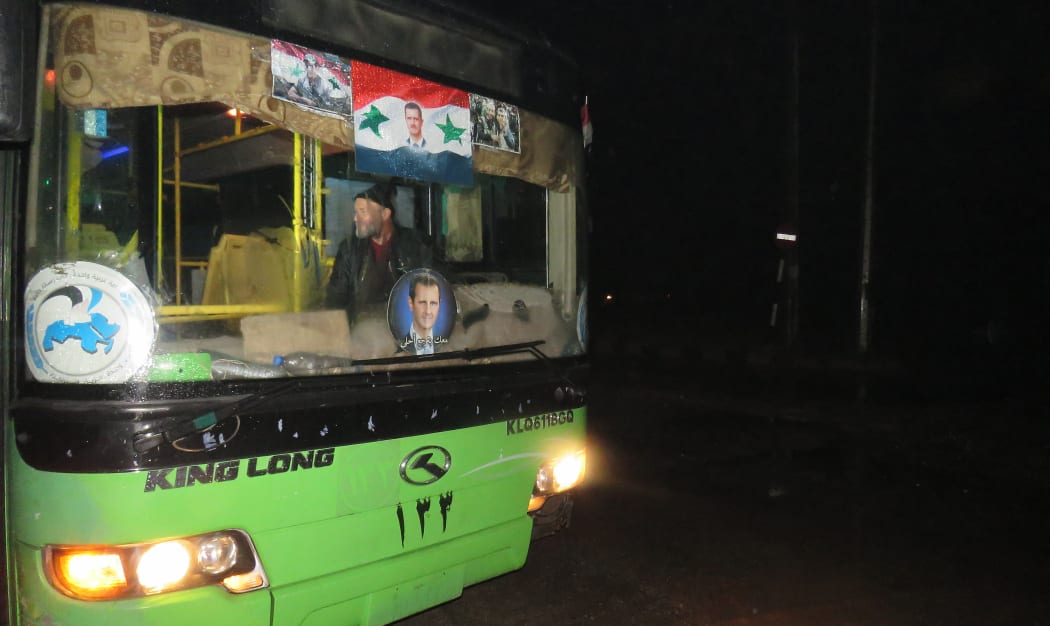 A bus which will be used to evacuate civilians leaving from rebel-held areas of Aleppo is seen on 13 December, 2016.