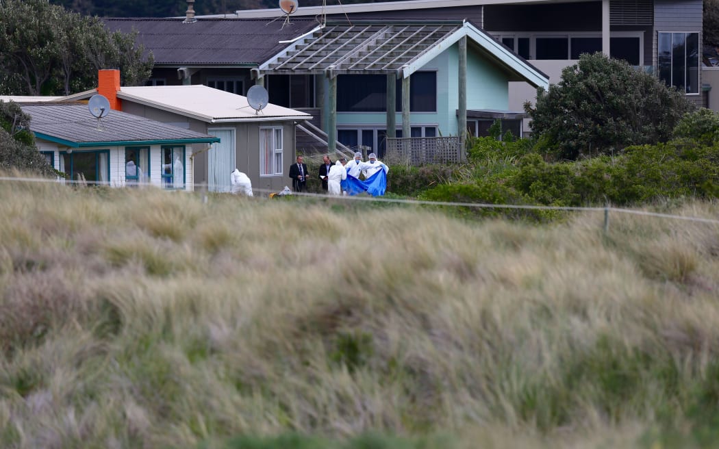 Forensic staff begin their investigation at the site where 10-year-old Alex Fisher's body was found.