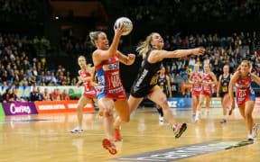 NSW Swift's Kimberlee Green takes a pass under pressure from Waikato BOP's Jamie-Lee Price during the ANZ Netball Championship semi final.