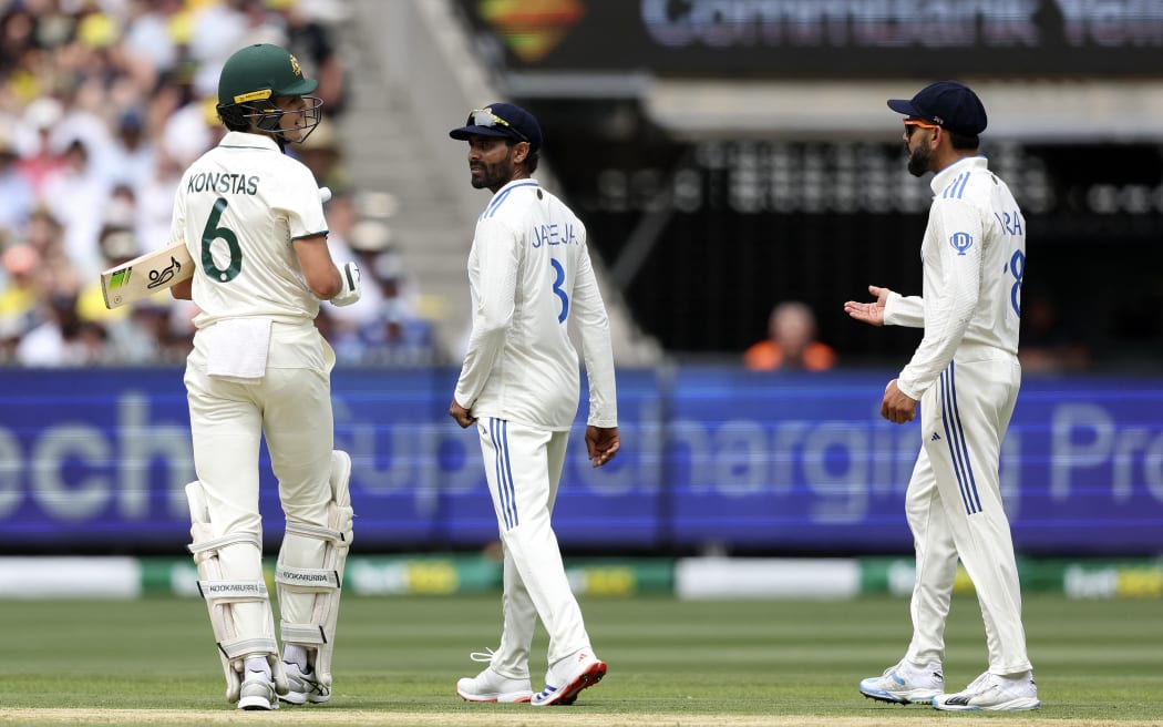 Australia's Sam Konstas (L) exchanges words with India's Virat Kohli (R) on day one of the fourth cricket Test match between Australia and India at the Melbourne Cricket Ground.
