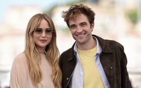 US actress Jennifer Lawrence and British actor Robert Pattinson pose during a photocall for the film "Die, My Love" at the 78th edition of the Cannes Film Festival in Cannes, southern France, on May 18, 2025. (Photo by Miguel Medina / AFP)