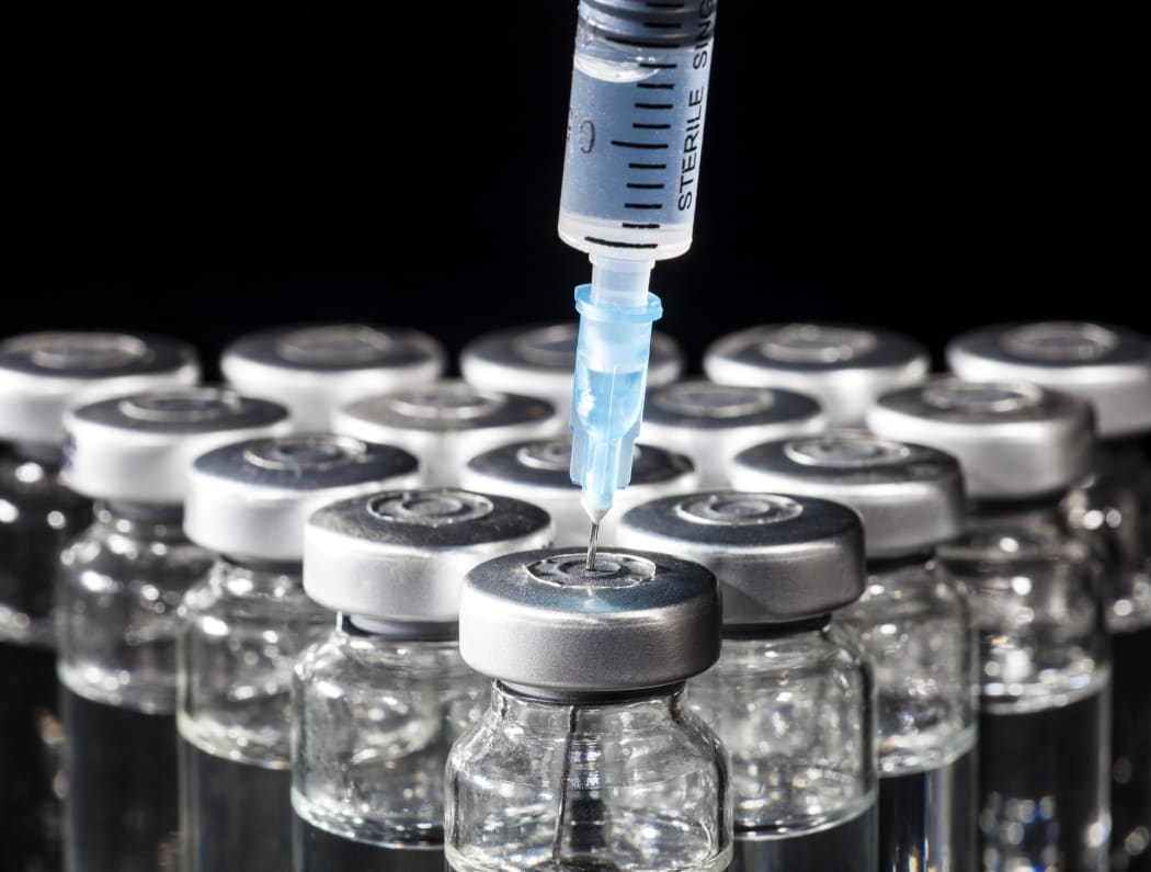 Medicine in vial and syringe.