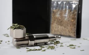 Synthetic cannabis and a pipe.