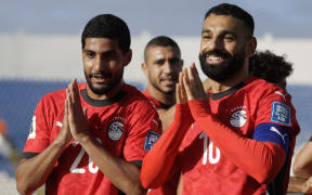 Egypt's forwards Ibrahim Adel and Mohamed Salah celebrate during FIFA World Cup qualifying.