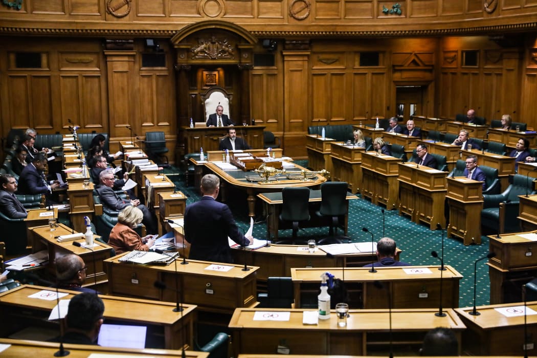 Minister for Covid-19 Response Chris Hipkins addresses a spaced out House sitting under Covid alert level 2