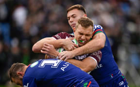 Tom Trbojevic of the Sea Eagles is tackled by Rocco Berry of the Warriors. New Zealand Warriors v Manly Warringah Sea Eagles, round 6 of the 2024 Telstra NRL Premiership at Go Media Stadium, Mt Smart, Auckland, New Zealand on Saturday 13 April 2024. Photo by Andrew Cornaga / www.photosport.nz