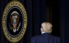 WASHINGTON, DC - DECEMBER 08: US President Donald Trump walks out after speaking at the Operation Warp Speed Vaccine Summit on December 08, 2020 in Washington, DC.