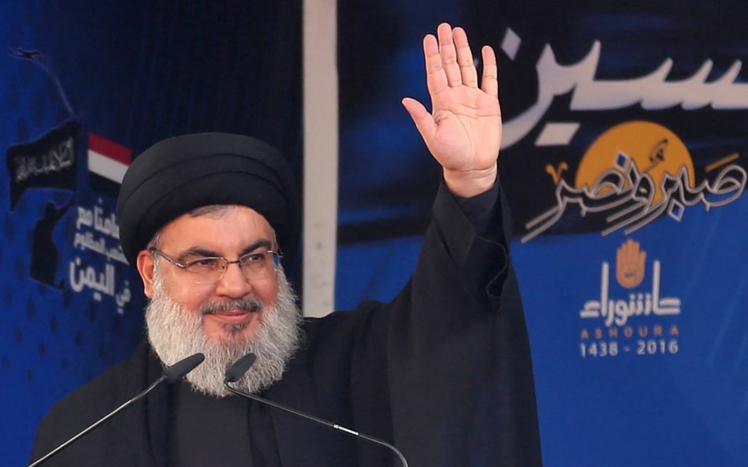 (FILES) Lebanon's Shiite movement's leader Hassan Nasrallah addresses a crowd during commemorations for Ashura in a southern Beirut suburb on October 12, 2016. Lebanon's Iran-backed Hezbollah group confirmed on September 28, 2024 that its leader Hassan Nasrallah had been killed, after Israel said it had "eliminated" him in a strike on south Beirut a day earlier. (Photo by PATRICK BAZ / AFP)