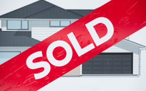 Sold sign outside a new house being built in East Auckland
