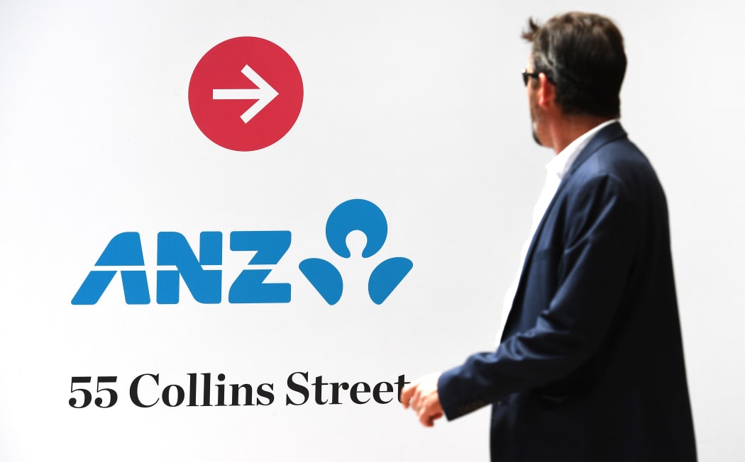 A man walks past an Australia and New Zealand Banking Group (ANZ) branch in Melbourne on October 31, 2019.
