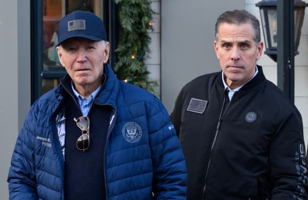 (FILES) US President Joe Biden (L) and son Hunter Biden step out of a bookstore while shopping in Nantucket, Massachusetts on November 29, 2024. Former president Biden's cancer has metastasized further, according to his son Hunter Biden, who shared the update in an interview with the BBC broadcasted on August 7, 2026. In May 2025, just four months after he left office as the oldest sitting president, the elder Biden revealed he had been diagnosed with an aggressive form of prostate cancer that had spread to his bones. (Photo by Mandel NGAN / AFP)