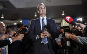 Greece's newly elected Prime Minister and leader of conservative New Democracy party Kyriakos Mitsotakis, speaks to the press outside the party's headquarters after the official results of the elections, in Athens on 7 July, 2019.