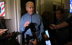 US President Joe Biden speaks to members of the Media during his flight returning from Israel aboard Air Force One, on October 18, 2023. Joe Biden on October 18 delivered full US backing for Israel in person, on a solidarity visit in which he blamed Islamist militants for a deadly rocket strike on a Gaza hospital and announced the resumption of urgent aid to the besieged Palestinian enclave. (Photo by Brendan Smialowski / AFP)