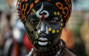 A Hindu devotee looks on as he takes part in a religious procession of Naya Udasin Akhara ahead of the Maha Kumbh Mela festival in Prayagraj on January 10, 2025. (Photo by Niharika KULKARNI / AFP)