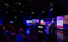 Labour leader Chris Hipkins and National leader Chris Luxon at TVNZ's second leaders' debate, with moderater, 1News Political Editor Jessica Mutch McKay.
