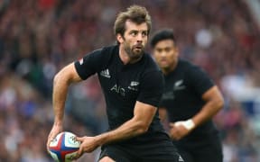 The All Blacks centre Conrad Smith in action against England.