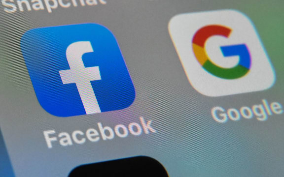 Facebook and Google apps on a a tablet.