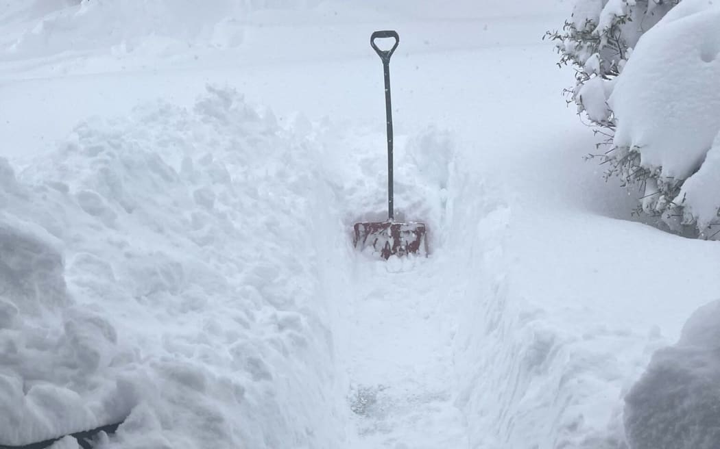 Large amounts of snow piled up at a home in Erie County, Pennsylvania.