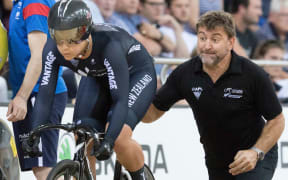 Sprint coach Anthony Peden give Natasha Hansen a push during a World Cup event in Cambridge in 2015.