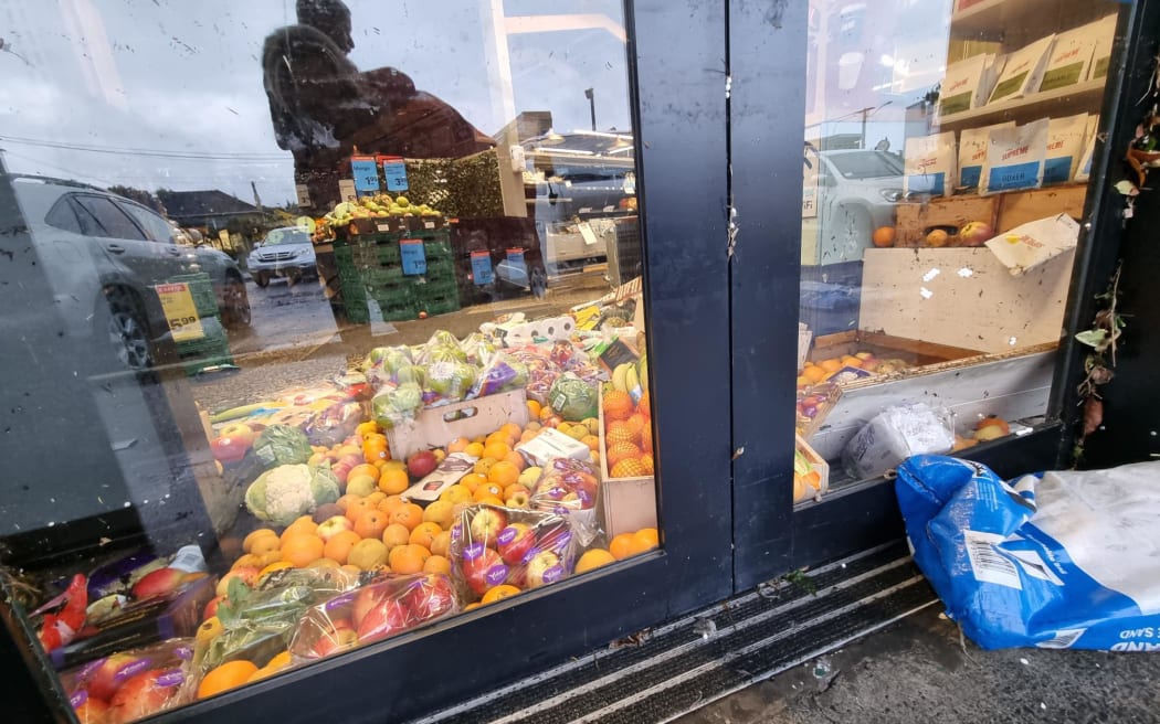People were briefly trapped in the small Fresh Collective supermarket in Mt Albert, Auckland, as water rose at the doors after the heavy rain.