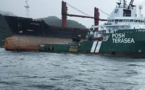 The Wise Honest is towed out to the middle of Pago Pago Harbour