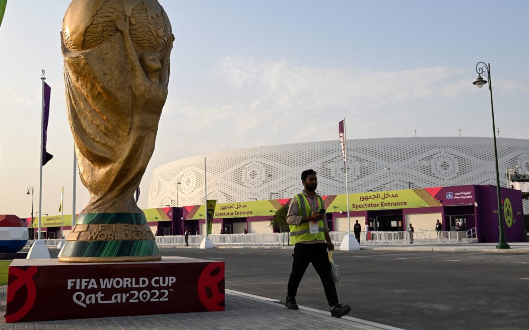 A man walks outside the Al-Thumama Stadium in Doha on November 8, 2022, ahead of the Qatar 2022 FIFA World Cup football tournament. (Photo by Kirill KUDRYAVTSEV / AFP)