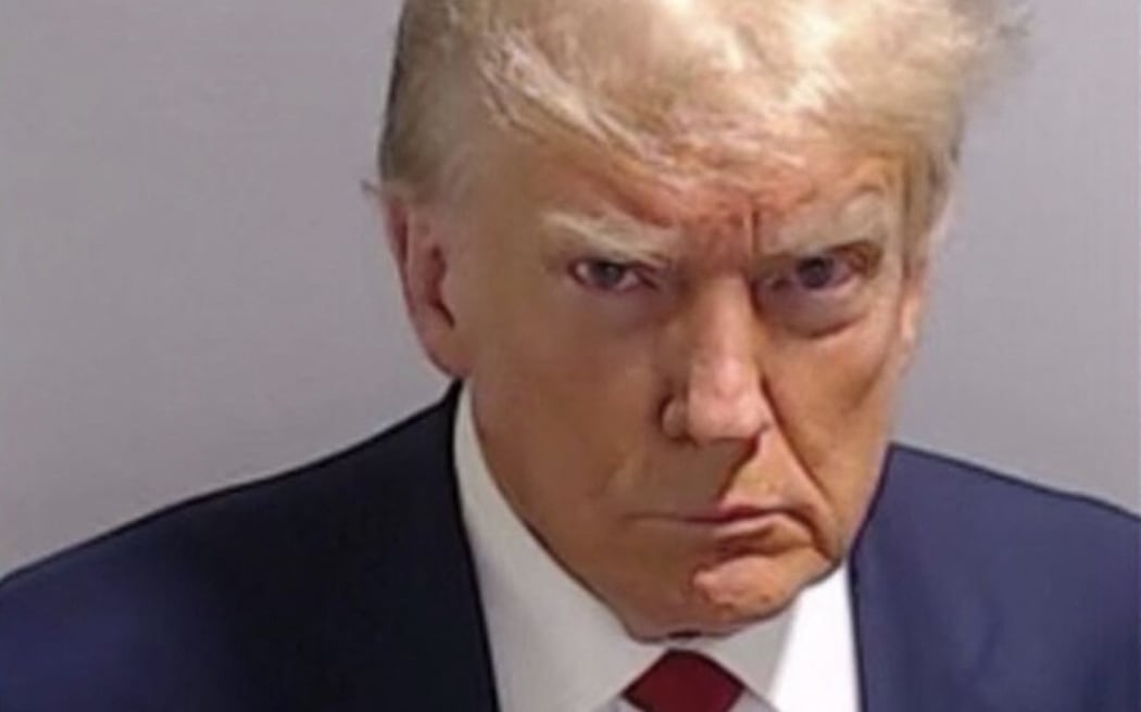 This handout image released by the Fulton County Sheriff's Office on August 24, 2023 shows the booking photo of former US President Donald Trump.