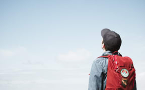 teenage boy looks up