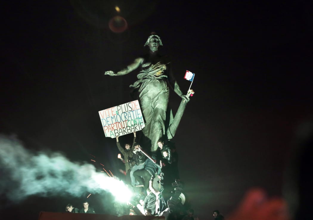 The huge march ended at Place de la Nation where demonstrators held a sign reading 'Hurry, more democracy everywhere against barbarism'.