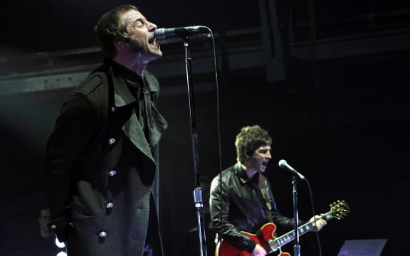 Liam and Noel Gallagher on stage in Munich, 2009.