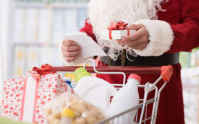 Santa Claus doing grocery shopping at the supermarket,